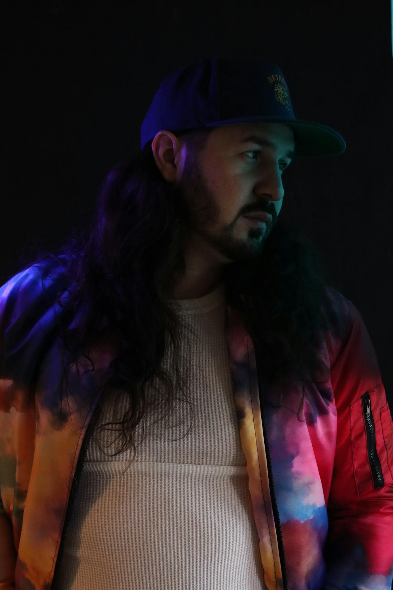 Colorful portrait of a male musician in a creative New York setting.